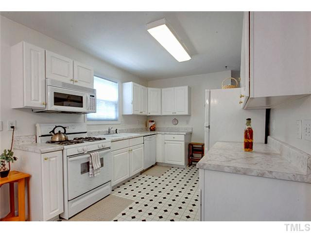 502 Windcrest Road Durham, NC 27713 - Photo 7 of 21 The kitchen is bright and cheerful. It comes equipped with a mocrowave, gas range, dishwasher and the refrigerator. Kitchen