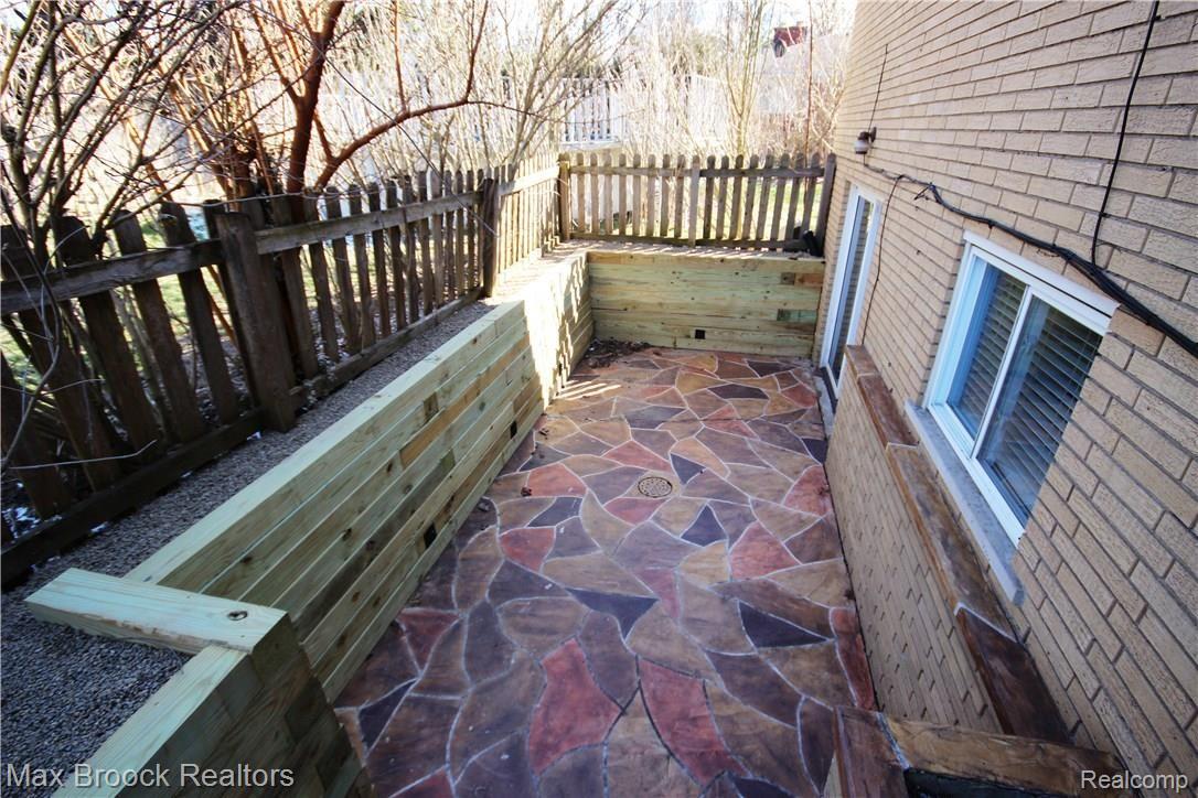 3770 Beach Road Troy, MI 48084 - Photo 31 of 31 Stone patio continues to the walk-out