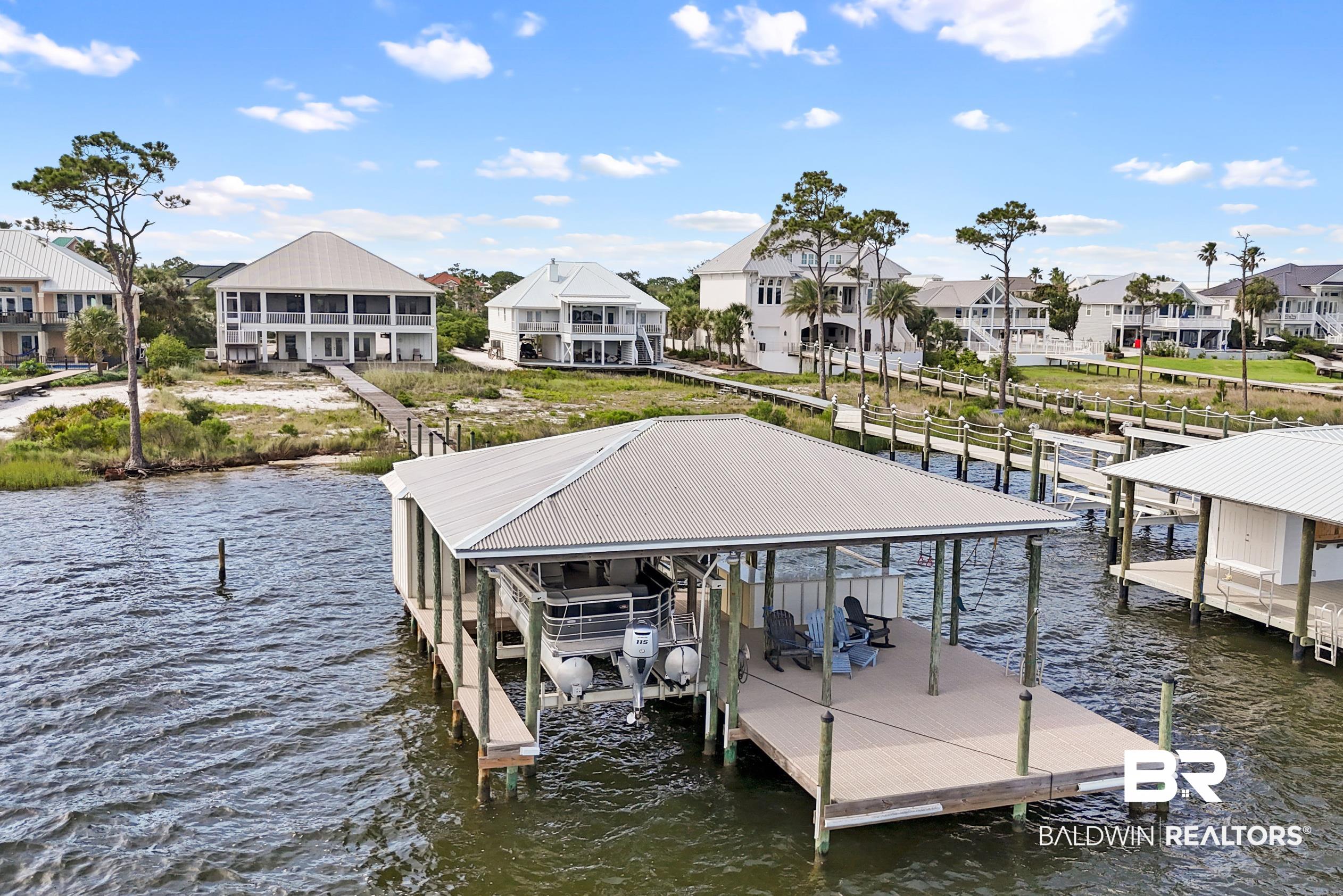32760 River Road Orange Beach, AL 36561 - Photo 48 of 49 Boat dock with tanning deck
