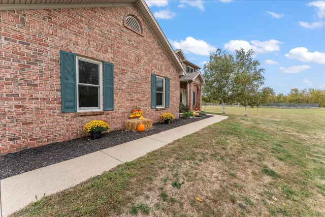 a living room with a fireplace cabinet and a fireplace