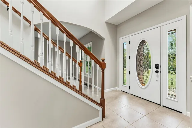 a kitchen with a refrigerator and a stove top oven