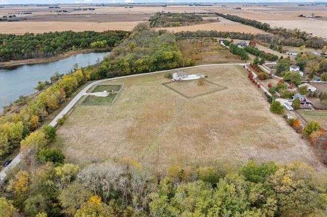 a kitchen with a refrigerator and a stove top oven