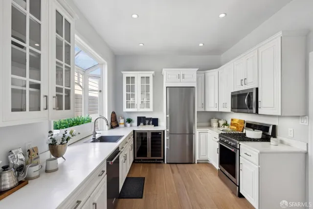 a kitchen with a sink and a large window