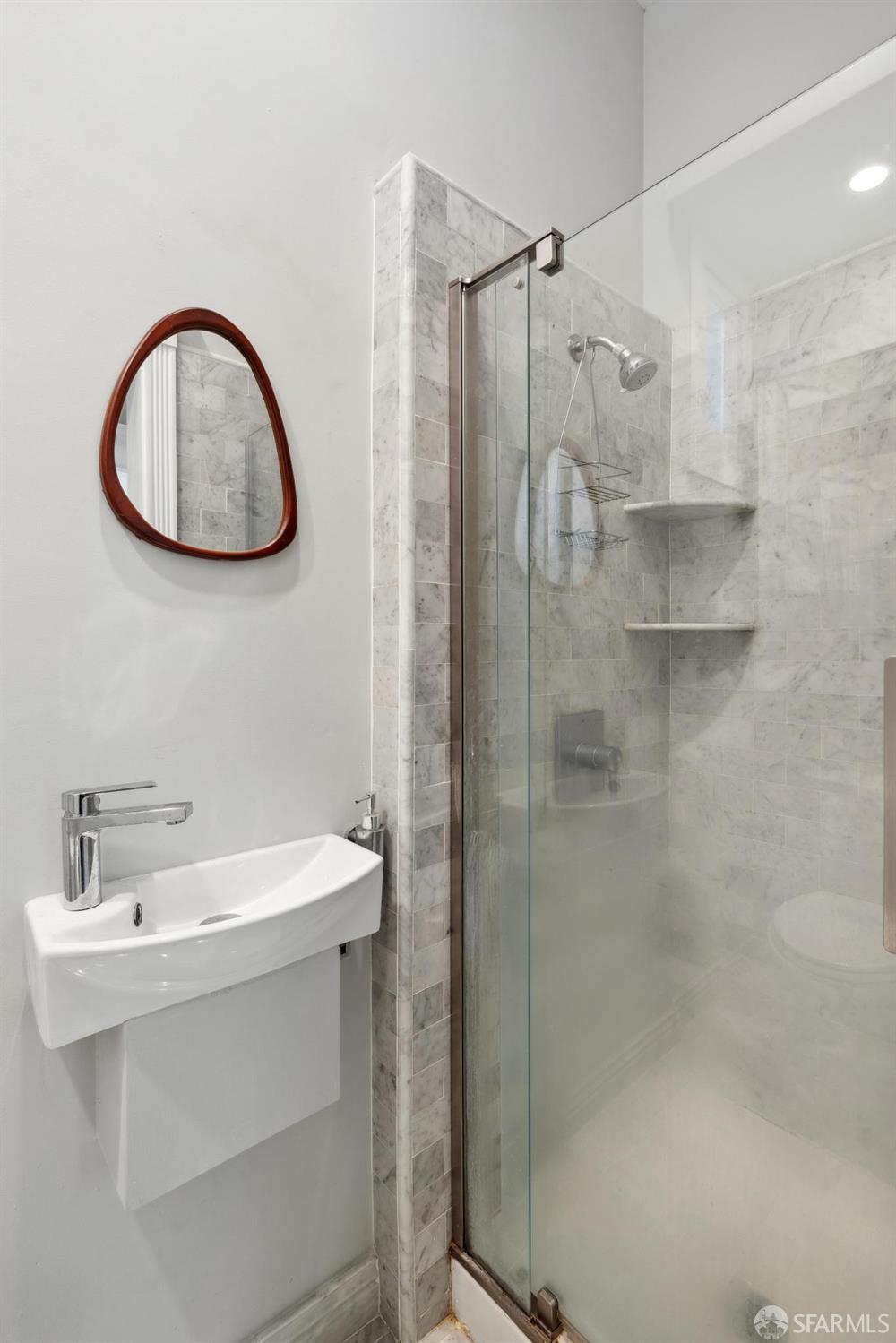 2344 Franklin Street San Francisco, CA 94123 - Photo 25 of 31 a bathroom with a sink and a mirror