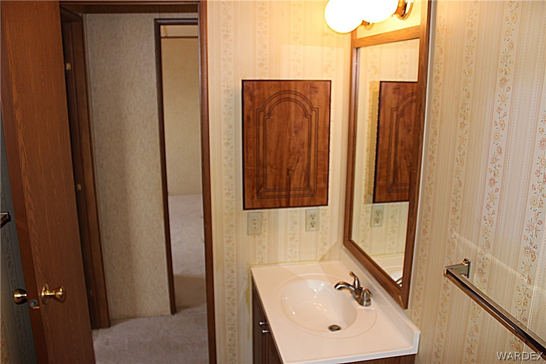 4197 Cordes Road Golden Valley, AZ 86413 - Photo 23 of 51 a bathroom with sink shower and mirror
