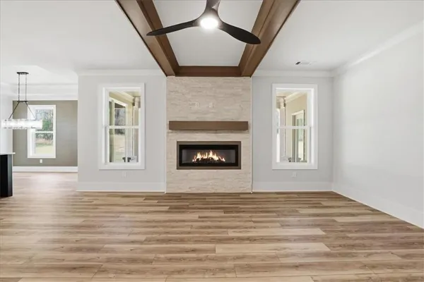 a large kitchen with kitchen island a large counter space a sink stainless steel appliances and cabinets