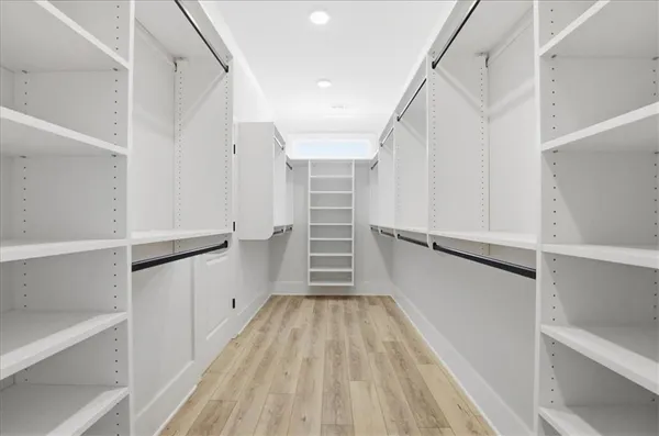 a view of room with window and hardwood floor