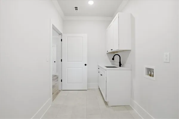 a view of a hallway with wooden floor and windows
