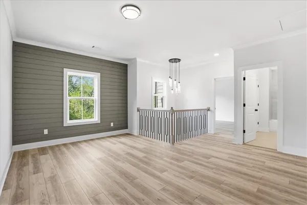 an aerial view of a house with a yard basket ball court and outdoor seating