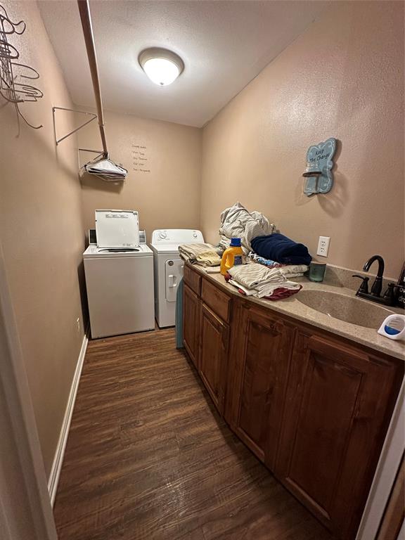 6551 Crooked Creek Road Bowie, TX 76230 - Photo 19 of 39 a room with a sink and wooden floor