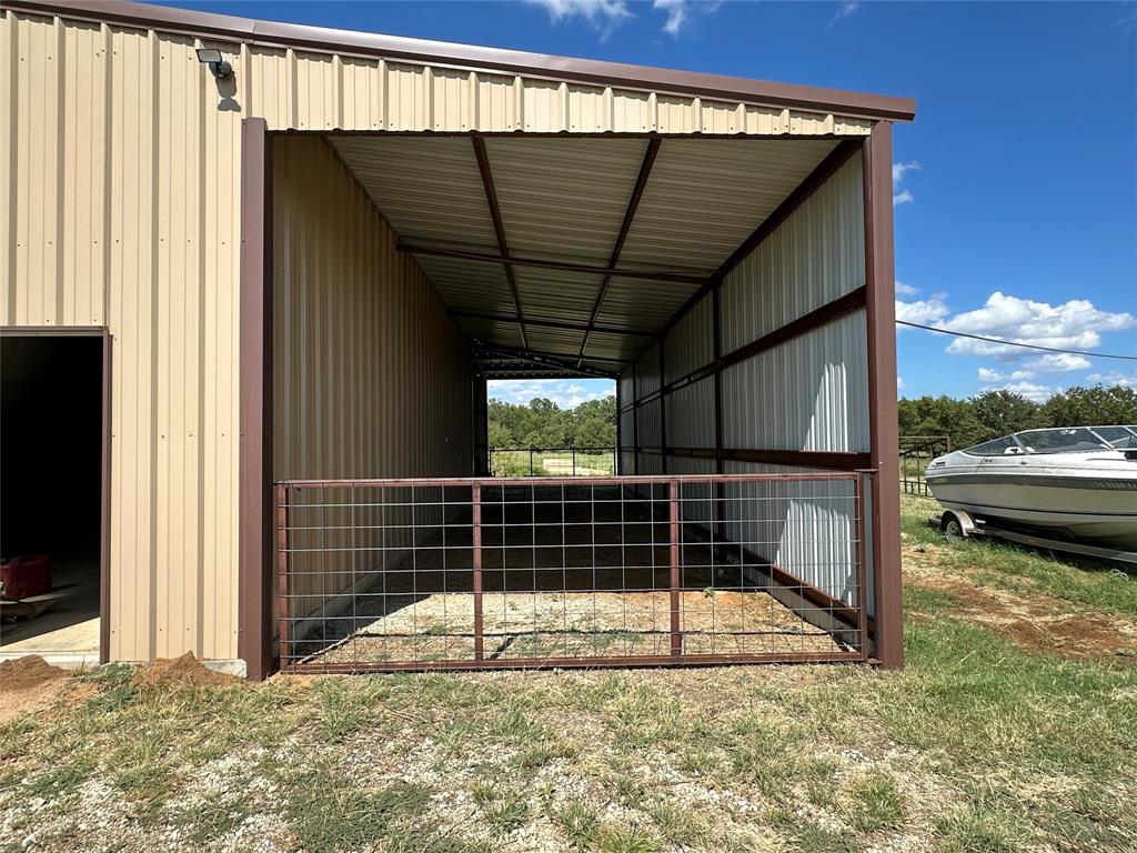 6551 Crooked Creek Road Bowie, TX 76230 - Photo 27 of 39 a view of a balcony with door