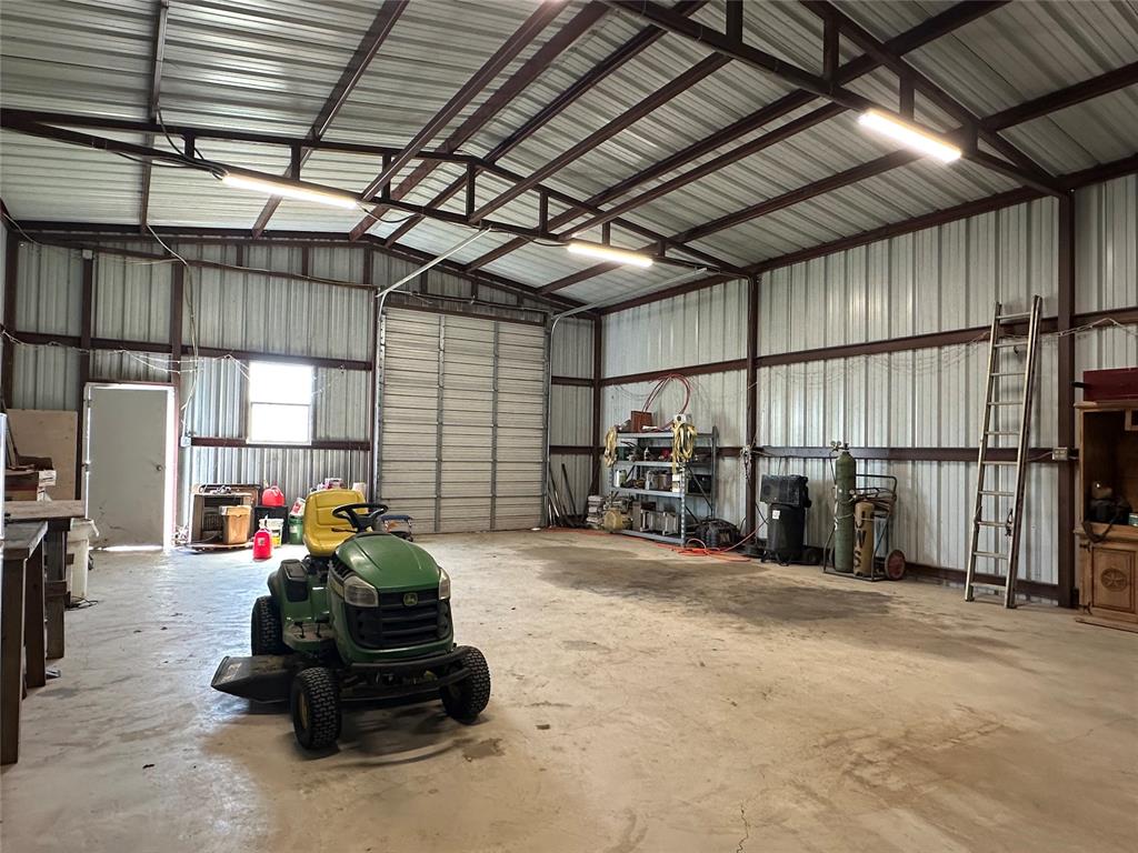 6551 Crooked Creek Road Bowie, TX 76230 - Photo 28 of 39 a view of a room with gym equipment