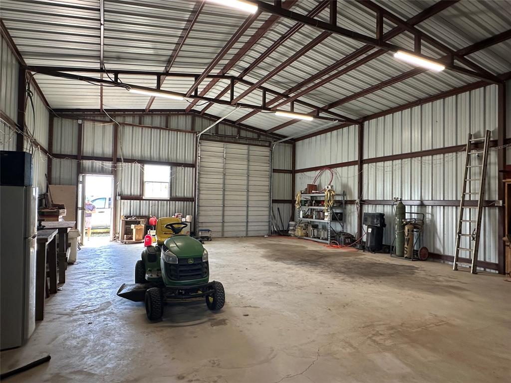 6551 Crooked Creek Road Bowie, TX 76230 - Photo 31 of 39 a garage with furniture