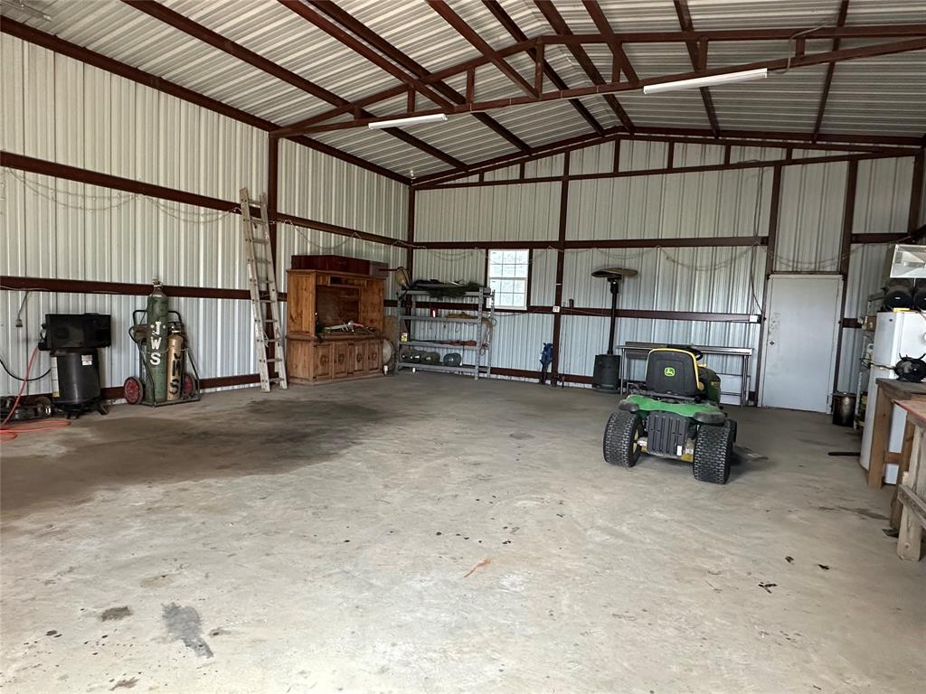 6551 Crooked Creek Road Bowie, TX 76230 - Photo 32 of 39 a view of storage and utility room