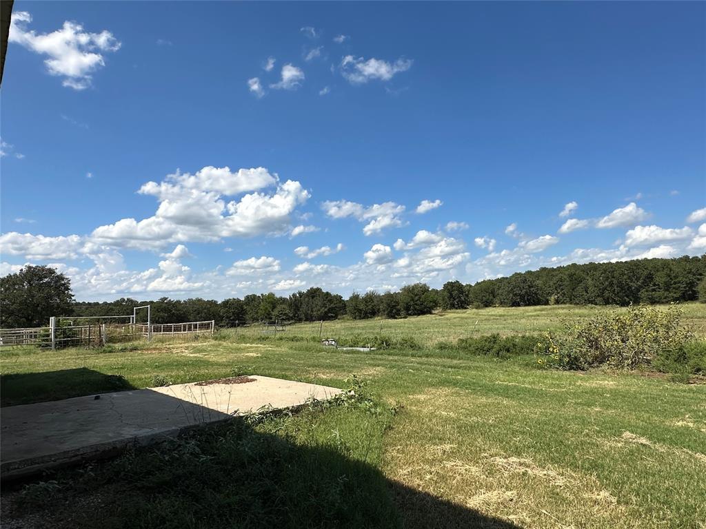 6551 Crooked Creek Road Bowie, TX 76230 - Photo 38 of 39 a view of a golf course with a lake