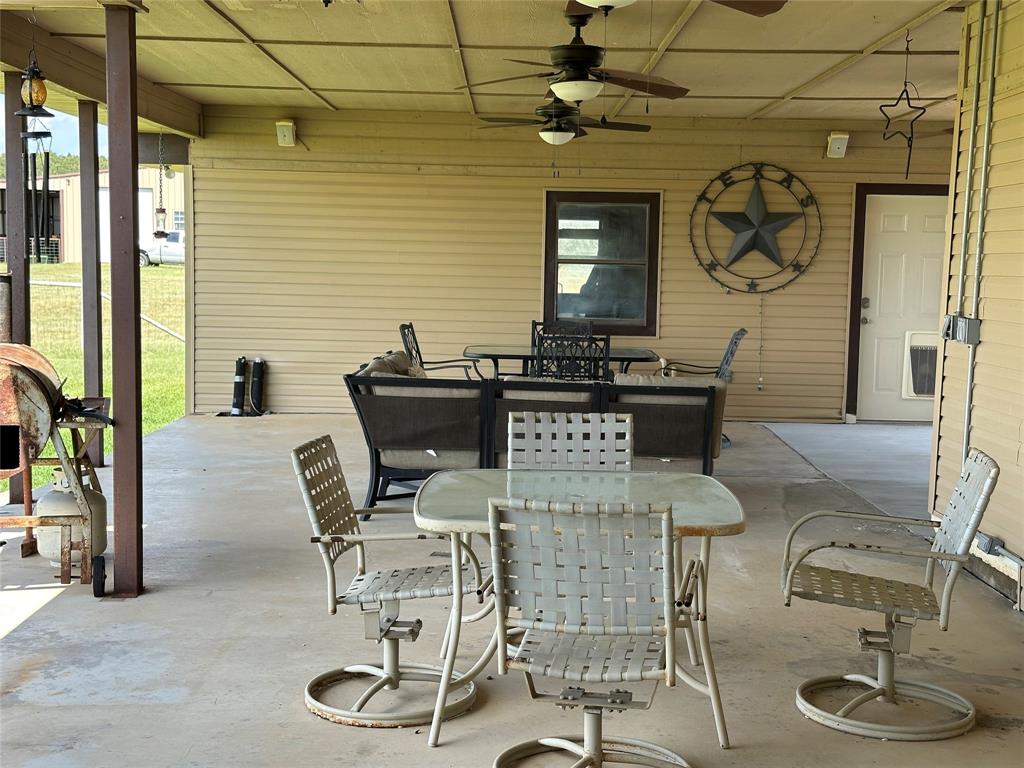 6551 Crooked Creek Road Bowie, TX 76230 - Photo 5 of 39 a dining room with furniture and window