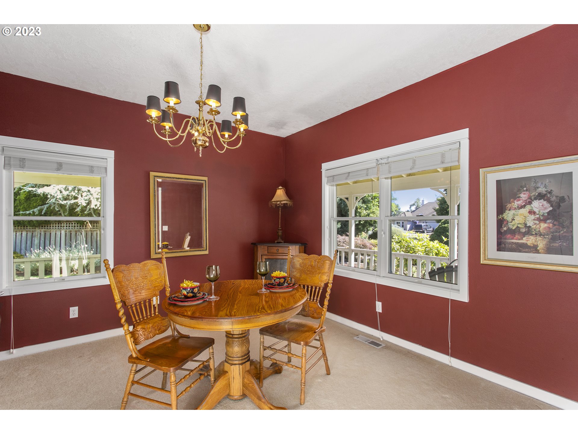 2371 Miller Farm Road Woodburn, OR 97071 - Photo 16 of 33 a dining room with furniture a large window and a chandelier