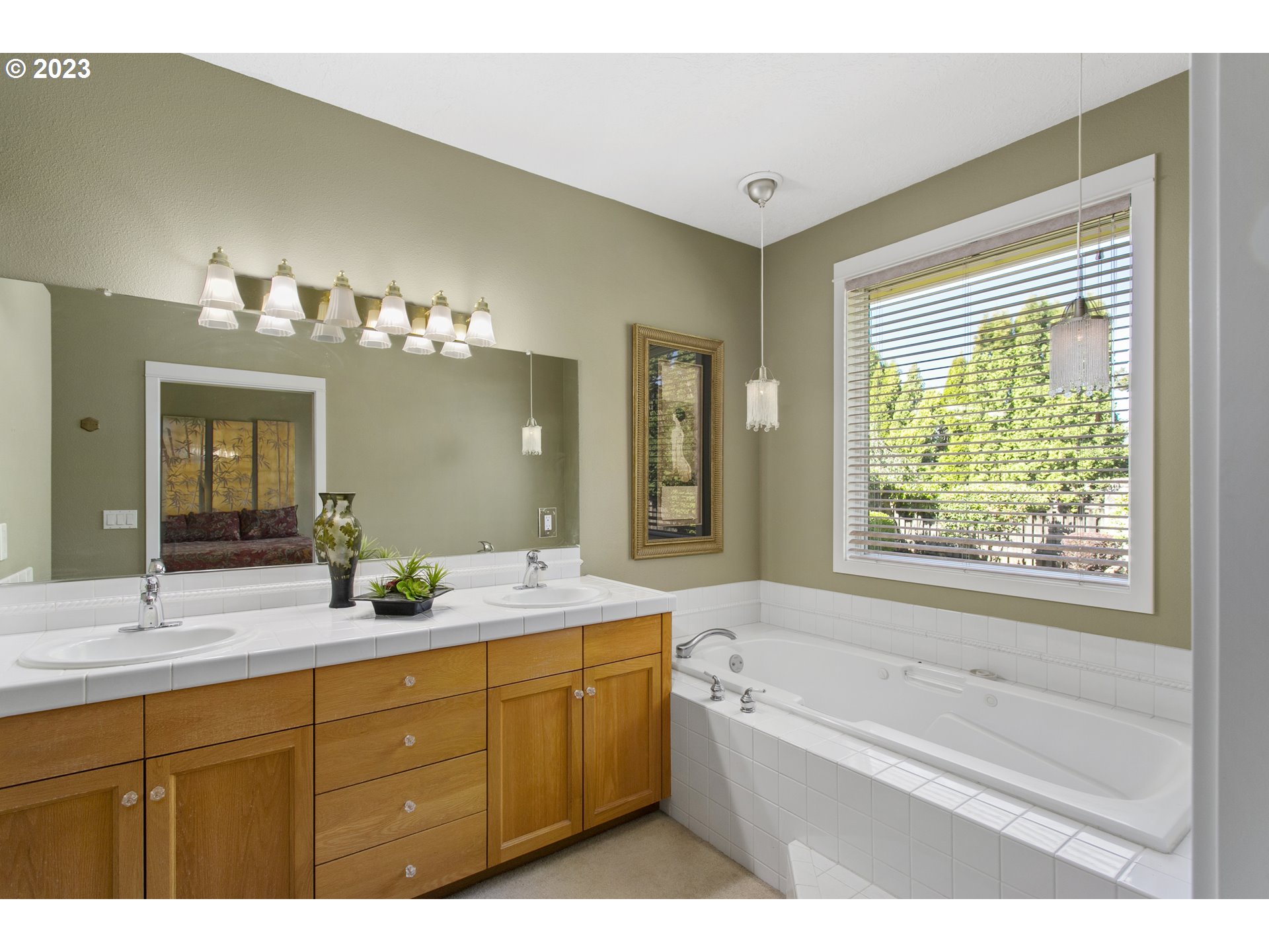 2371 Miller Farm Road Woodburn, OR 97071 - Photo 29 of 33 a bathroom with a granite countertop sink mirror and a bathtub