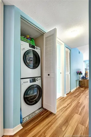 a view of a hallway with washer and dryer
