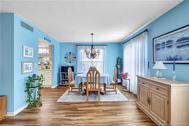 a living room with furniture a piano and a window