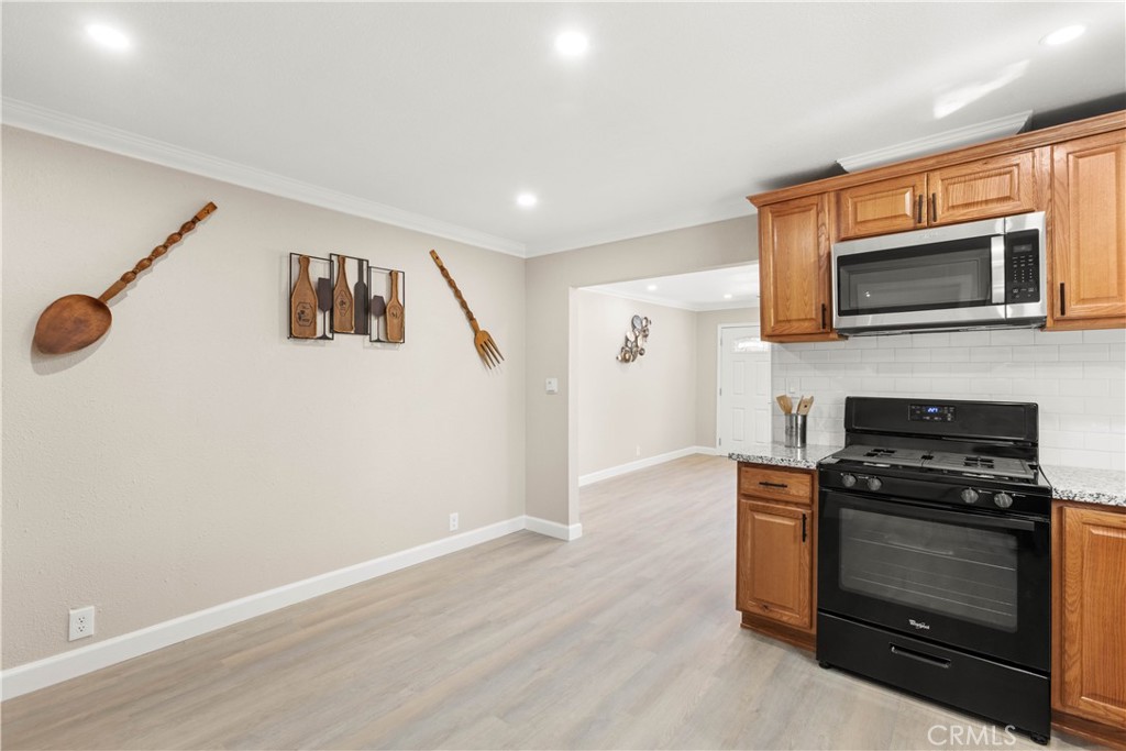 4936 Lower Wyandotte Road Oroville, CA 95966 - Photo 11 of 41 a kitchen with stainless steel appliances a stove microwave and refrigerator