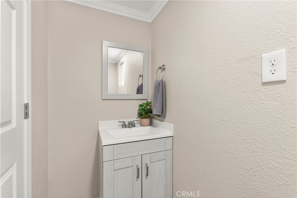 4936 Lower Wyandotte Road Oroville, CA 95966 - Photo 18 of 41 a bathroom with a sink vanity and a mirror