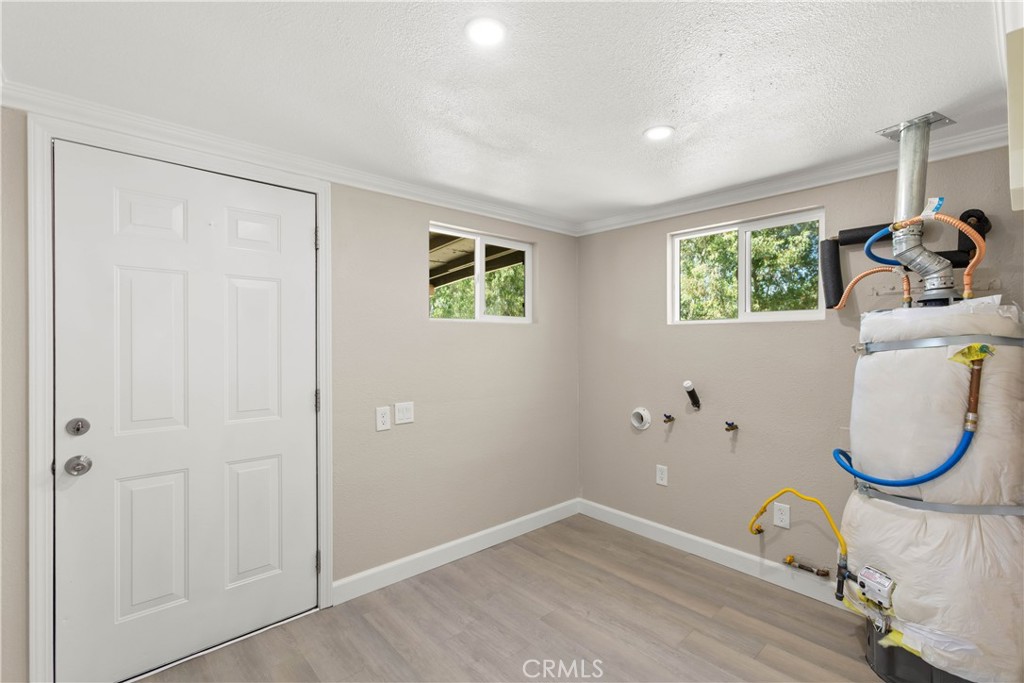 4936 Lower Wyandotte Road Oroville, CA 95966 - Photo 20 of 41 an entryway room with wooden floor and windows