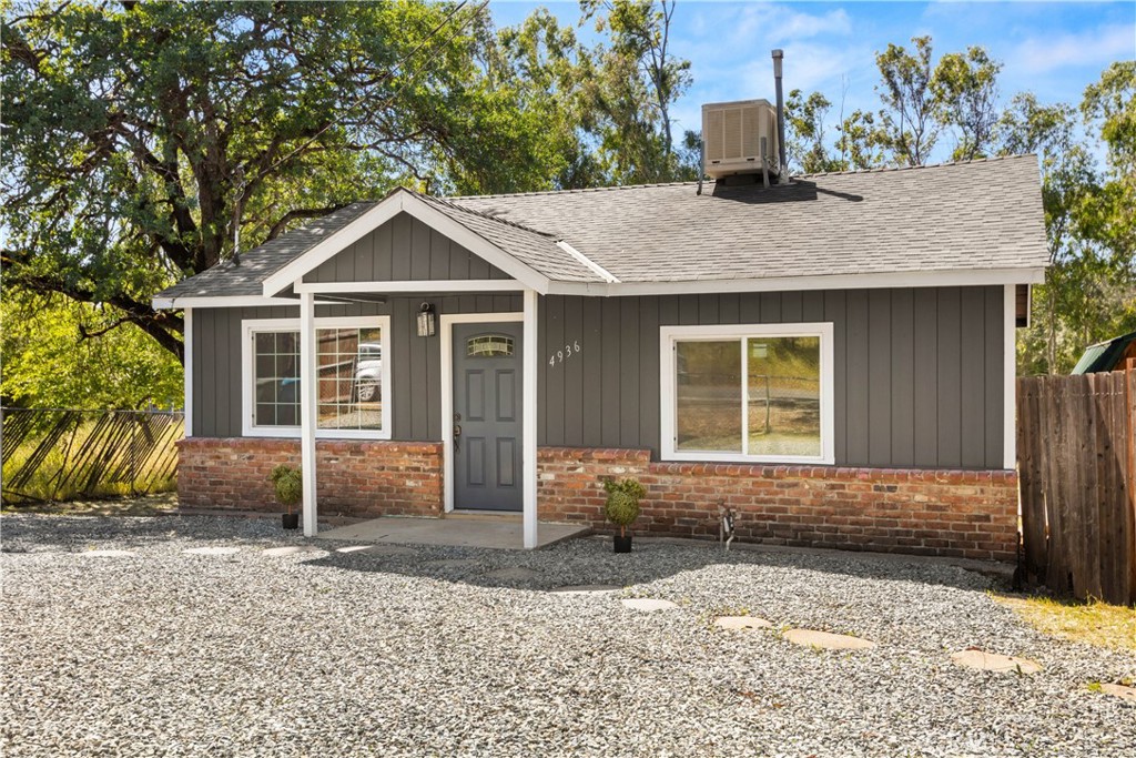 4936 Lower Wyandotte Road Oroville, CA 95966 - Photo 2 of 41 a front view of a house with garden