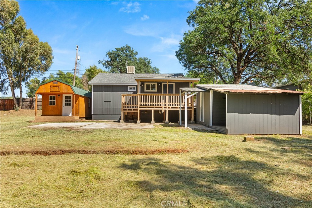 4936 Lower Wyandotte Road Oroville, CA 95966 - Photo 25 of 41 a front view of a house with a yard
