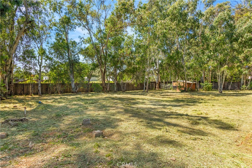 4936 Lower Wyandotte Road Oroville, CA 95966 - Photo 27 of 41 a swimming pool with trees in the background