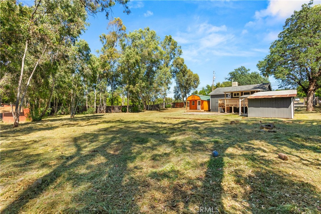 4936 Lower Wyandotte Road Oroville, CA 95966 - Photo 28 of 41 a front view of a house with a yard