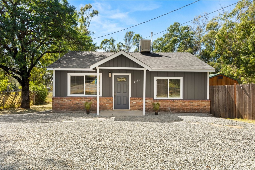 4936 Lower Wyandotte Road Oroville, CA 95966 - Photo 3 of 41 a view of a house with a yard and large tree