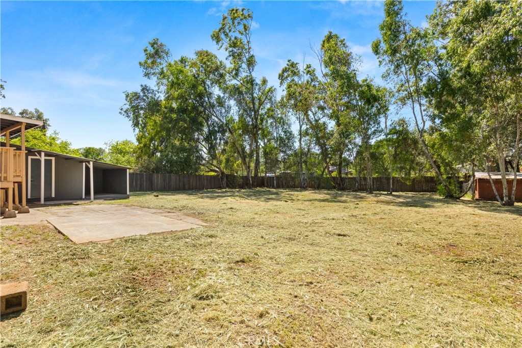 4936 Lower Wyandotte Road Oroville, CA 95966 - Photo 32 of 41 a swimming pool with wooden fence