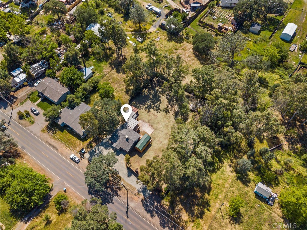 4936 Lower Wyandotte Road Oroville, CA 95966 - Photo 37 of 41 an aerial view of residential house with outdoor space and trees all around
