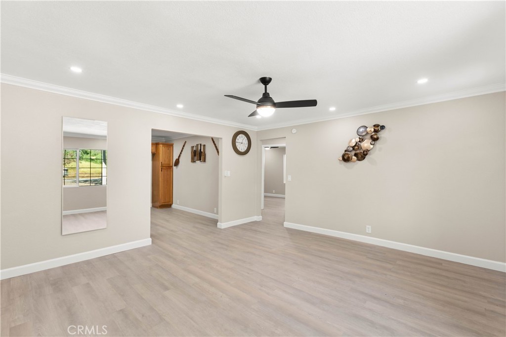 4936 Lower Wyandotte Road Oroville, CA 95966 - Photo 7 of 41 wooden floor in an empty room with a window