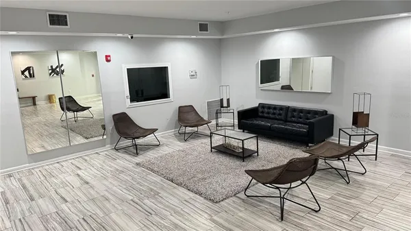 a living room with a couch and a rug