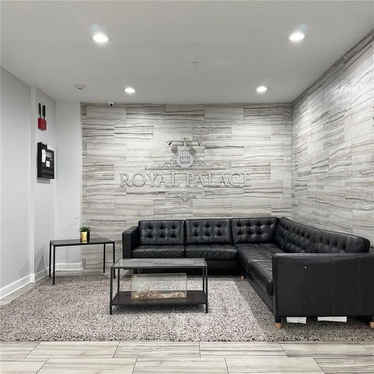 2121 McCoy Road, Unit 337 Orlando, FL 32809 - Photo 20 of 22 a living room with a couch and a rug