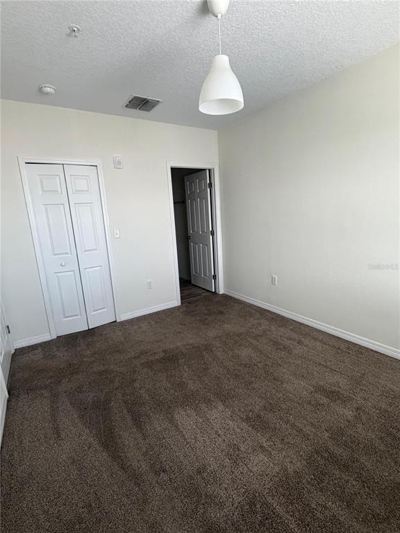 2121 McCoy Road, Unit 337 Orlando, FL 32809 - Photo 5 of 22 a view of an empty room and a chandelier fan