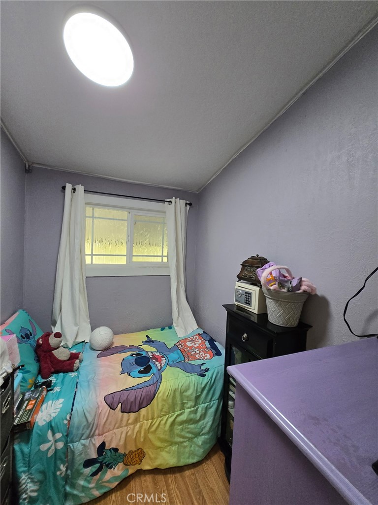 12401 Filmore Street Sylmar, CA 91342 - Photo 16 of 17 a bedroom with two bed and a table