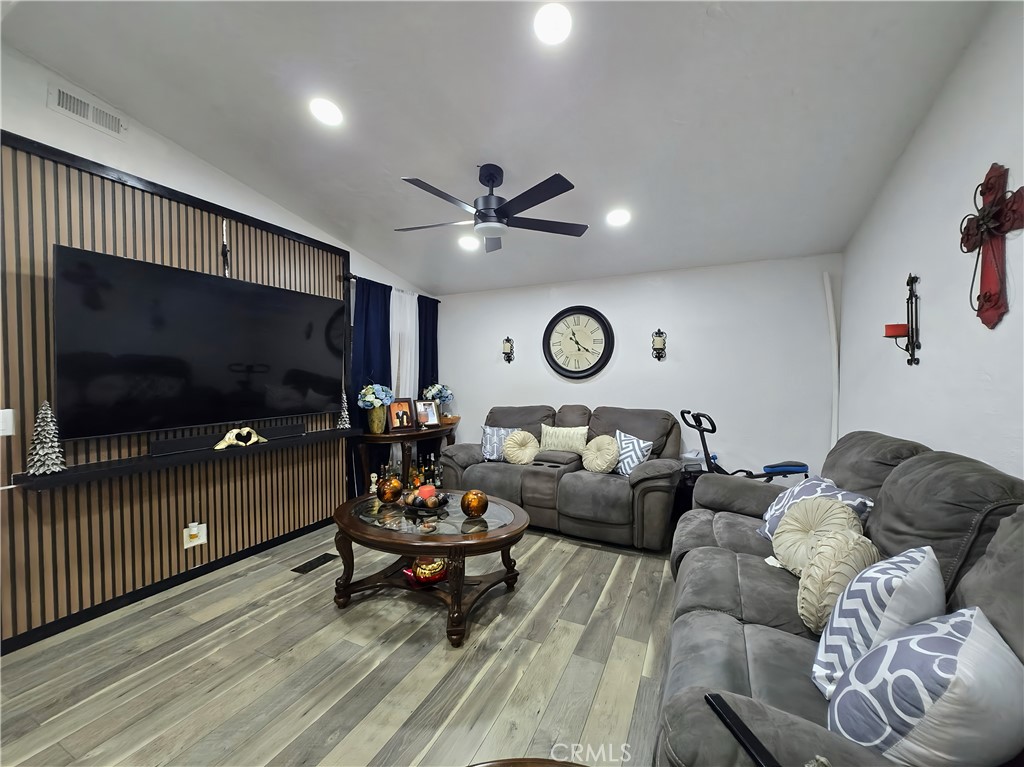 12401 Filmore Street Sylmar, CA 91342 - Photo 3 of 17 a living room with furniture and a flat screen tv