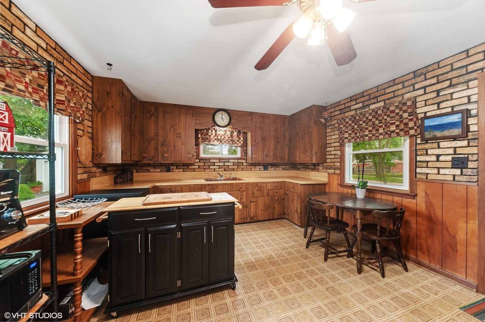 205 Wheeling Avenue Wheeling, IL 60090 - Photo 11 of 25 a kitchen with stainless steel appliances granite countertop a sink a stove and a refrigerator