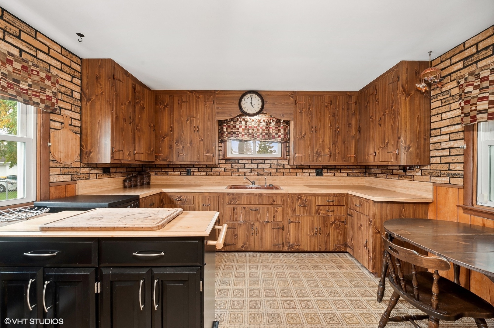 205 Wheeling Avenue Wheeling, IL 60090 - Photo 12 of 25 a kitchen with a sink and cabinets