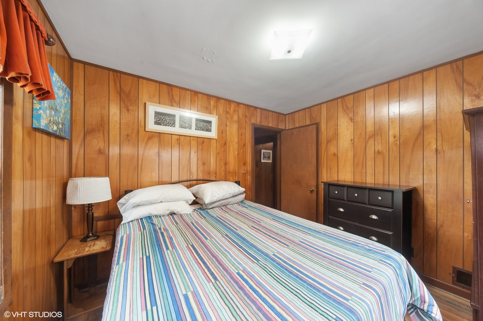 205 Wheeling Avenue Wheeling, IL 60090 - Photo 16 of 25 a bedroom with a bed and a dresser with mirror