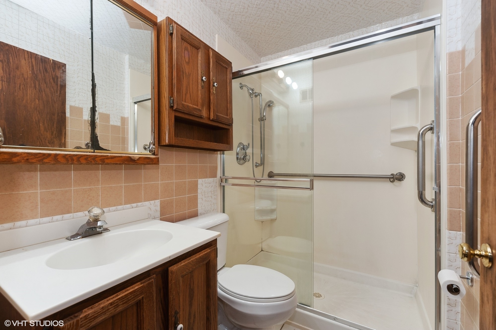 205 Wheeling Avenue Wheeling, IL 60090 - Photo 17 of 25 a bathroom with a sink a toilet and shower