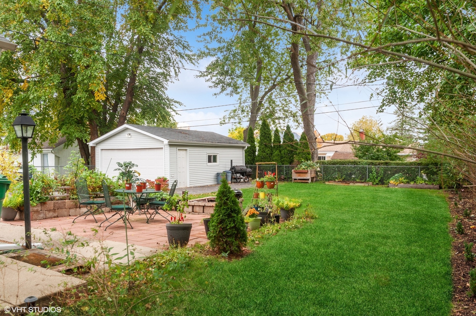 205 Wheeling Avenue Wheeling, IL 60090 - Photo 20 of 25 a front view of a house with garden