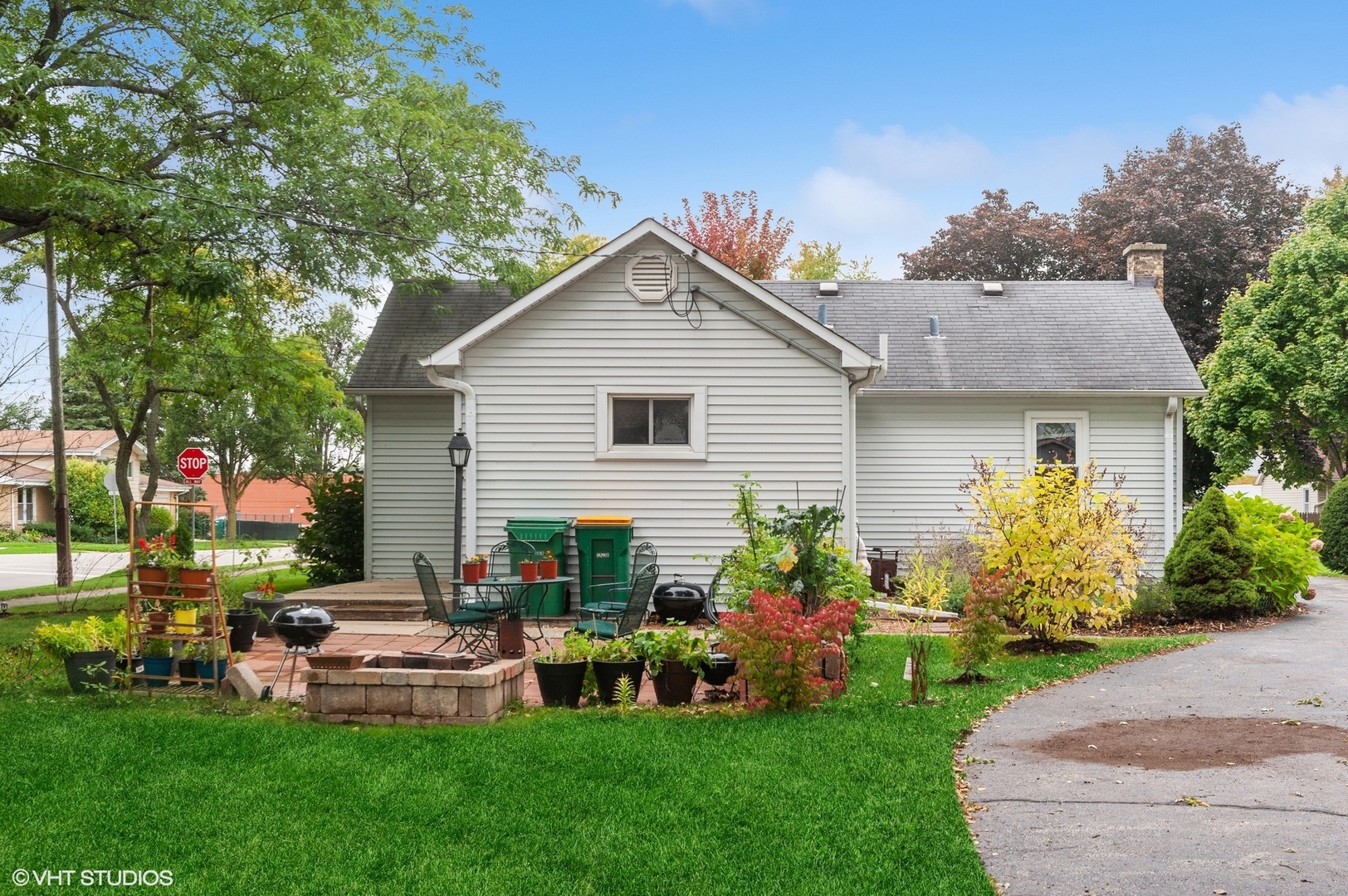 205 Wheeling Avenue Wheeling, IL 60090 - Photo 21 of 25 a front view of house with yard and outdoor seating