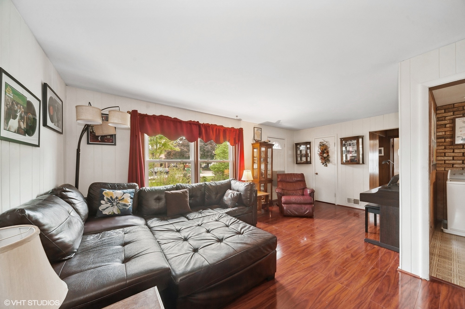 205 Wheeling Avenue Wheeling, IL 60090 - Photo 5 of 25 a living room with furniture large window and wooden floor