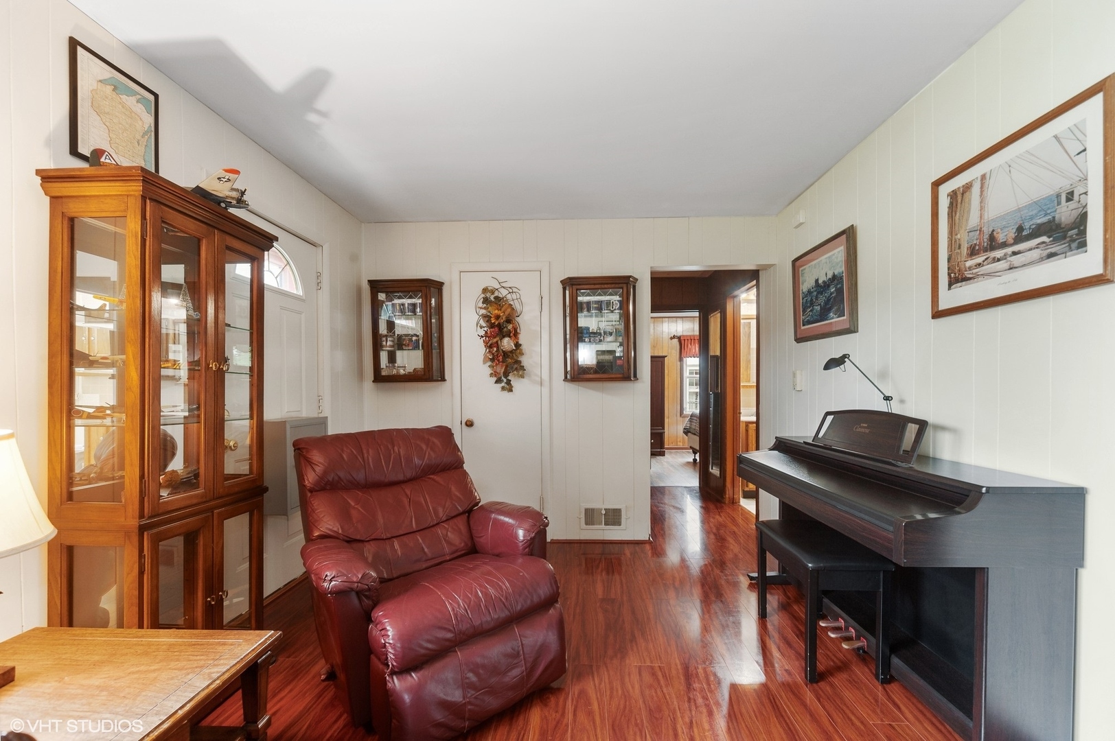 205 Wheeling Avenue Wheeling, IL 60090 - Photo 6 of 25 a living room with furniture rug and wooden floor