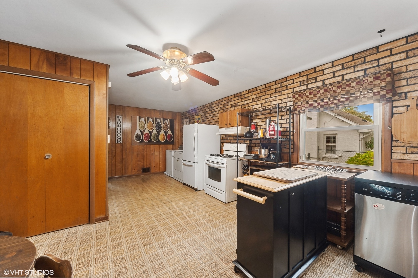 205 Wheeling Avenue Wheeling, IL 60090 - Photo 10 of 25 a view of a kitchen with furniture and stainless steel appliances