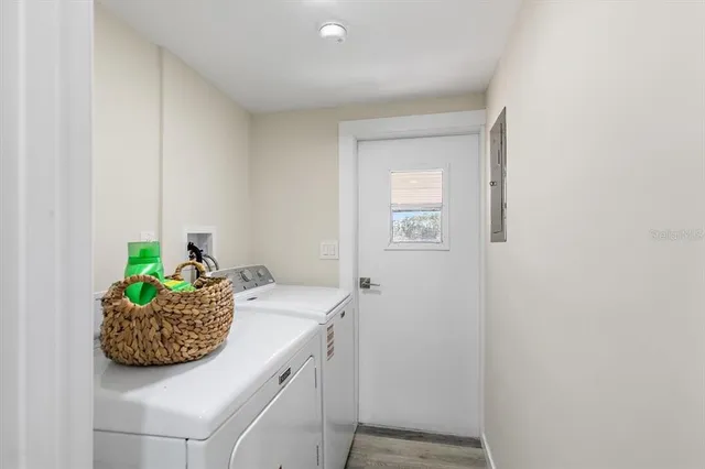 a room with a granite countertop sink and a window